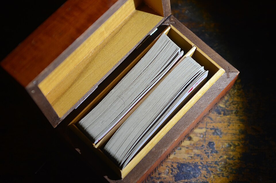 Two decks of playing cards in a wooden box